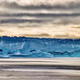 An iceberg calved from Dalk Glacier floats in Thala Fjord.